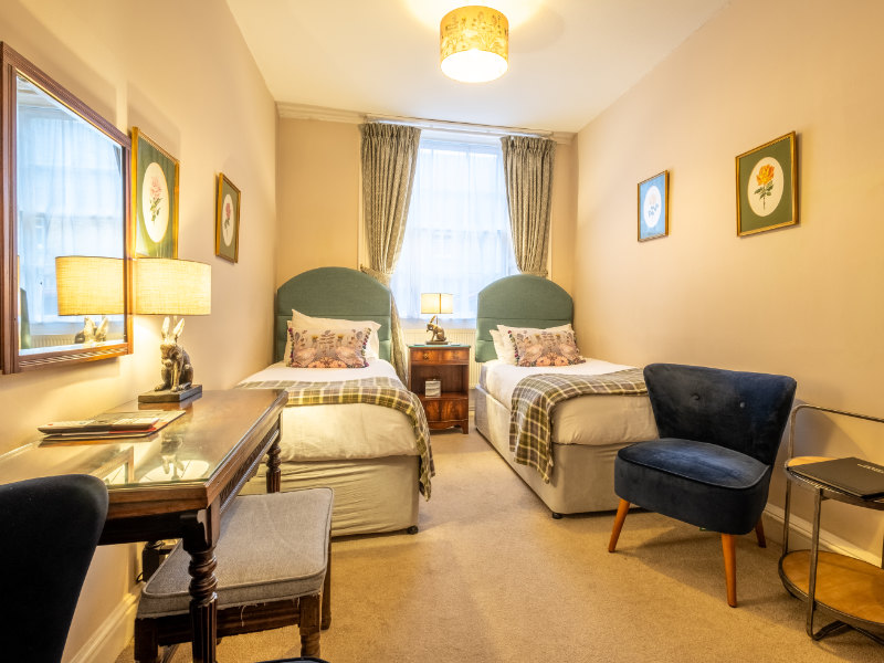 Twin bedrooms at The Corinium Hotel